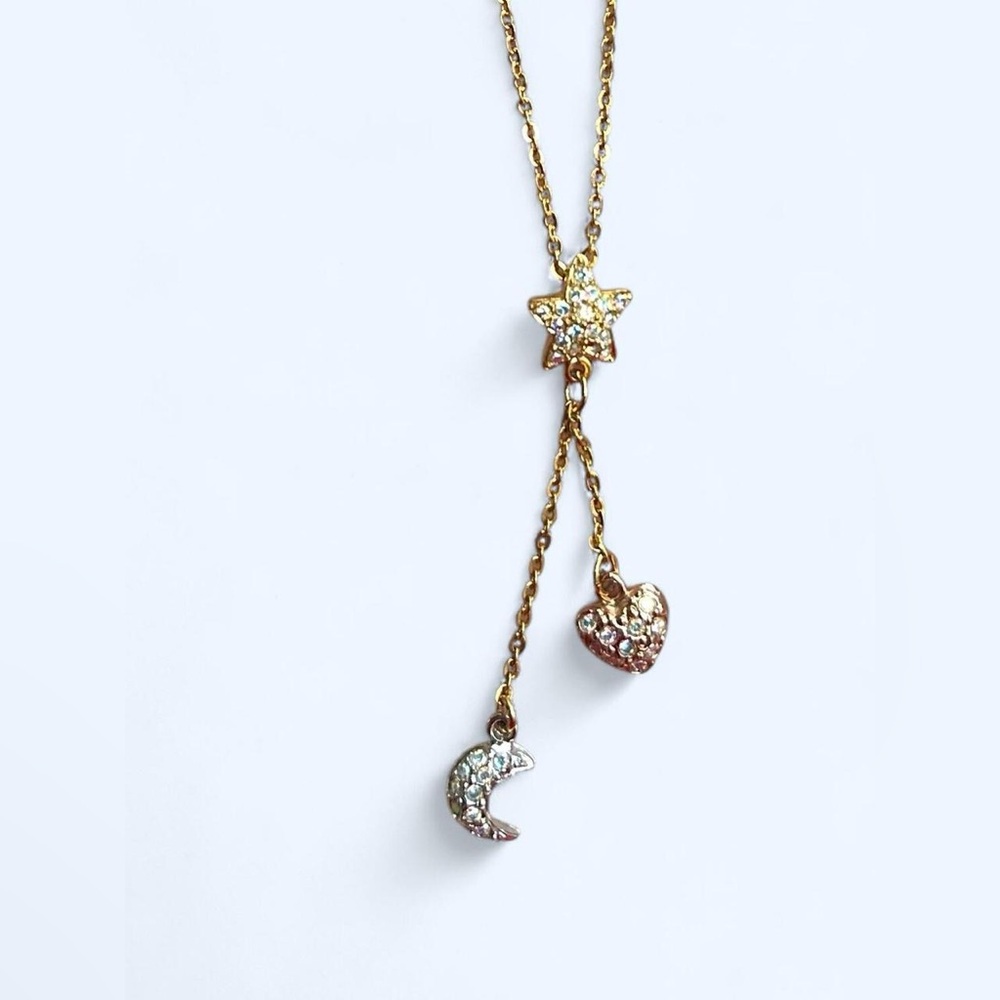 Vintage gold toned Kirk folly celestial necklace moon star and heart